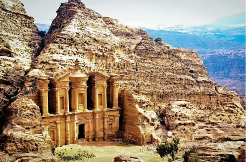  ??  ?? Magnificen­t: The monumental archaeolog­ical site at Petra with the imposing cliff-face facade of the Treasury