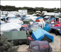  ?? AP/THIBAULT CAMUS ?? The makeshift migrant camp in Calais, France, home to thousands of people who hope to reach Britain, is shown Monday.