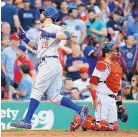  ?? MICHAEL DWYER/ASSOCIATED PRESS ?? Chicago’s Ben Zobrist (18) crosses the plate in the ninth inning after hitting a homer against Boston in the Cubs’ win Saturday.