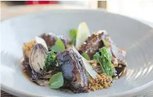  ??  ?? Braised lamb shanks by chef Tyler Day is a versatile dish that can be served with many healthy side portions.