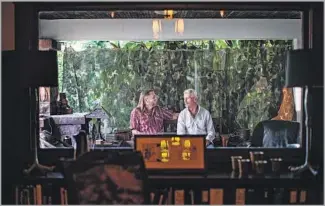  ?? Gina Ferazzi Los Angeles Times ?? SHARP, left, and Dehner, who curate Tom House’s art, are framed by the dining room window.