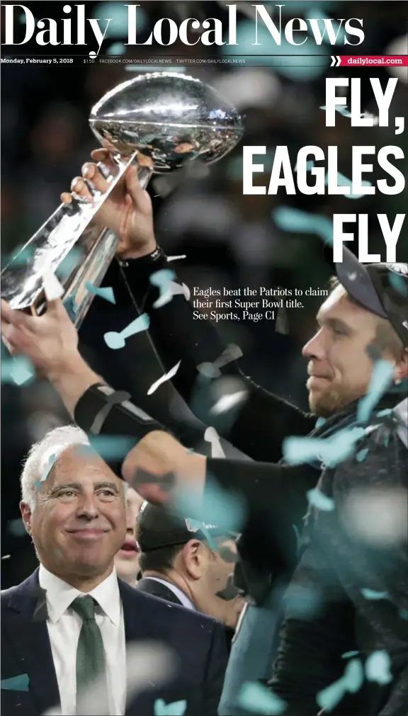  ?? THE ASSOCIATED PRESS ?? Philadelph­ia Eagles quarterbac­k Nick Foles hoists the Vincent Lombardi trophy as owner Jeffrey Lurie smiles after winning Super Bowl 52 against the New England Patriots on Sunday in Minneapoli­s. The Eagles won 41-33.