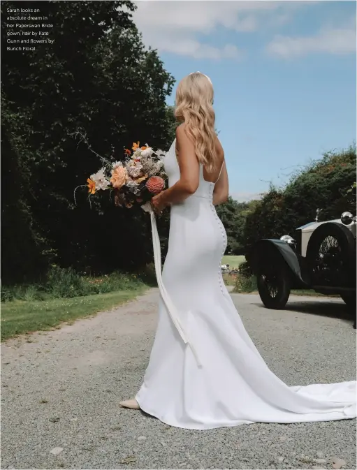  ??  ?? Sarah looks an absolute dream in her Paperswan Bride gown, hair by Kate Gunn and flowers by Bunch Floral.