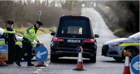  ?? ?? Grim day: A hearse at the scene of the horrific crash in Carlow