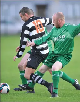  ??  ?? Aaron Comerford of Quay Celtic is brought down for a penalty kick by Duleek’s Guilfoyle at Clancy Park.