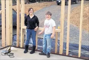  ?? Mindi Ramos and t he Shepherd f amily ?? KRESSA SHEPHERD, left, and her younger brother, Kai, are shown at their home in Redwood Valley when it was under constructi­on a couple of years ago. Their parents, Jon and Sara Shepherd, remain hospitaliz­ed.