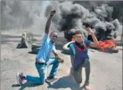  ?? AFP ?? Protesters react following the resignatio­n of Prime Minister Ariel Henry, in Port-au-Prince, Haiti, on Tuesday.