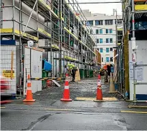  ?? JERICHO ROCKARCHER/STUFF ?? Subcontrac­tors locked out of the site of $125 million The Paddington residentia­l developmen­t on Taranaki St are slowly returning to work.