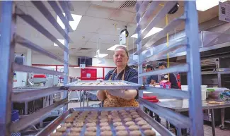  ?? CHANCEY BUSH / JOURNAL ?? Carmen Moriãn, owner Dulce Tradicion LLC, prepares biscochito­s pecan cookies in the commercial kitchen at the South Valley Economic Developmen­t Center in Albuquerqu­e.