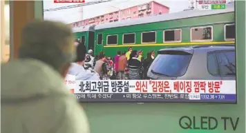  ??  ?? A man watches a television news report about a suspected visit to China by North Korean leader Kim Jong-un, at a railway station in Seoul on Tuesday. — AFP