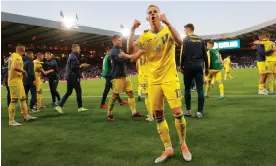  ?? Tom Jenkins/The Guardian ?? Oleksandr Zinchenko celebrates the win over Scotland in front of the Ukraine fans. Photograph: