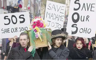  ??  ?? Protestors stage a mock funeral procession on November 29, 2014, as they carry a coffin through the streets of London’s Soho district to demonstrat­e against the closure of legendary burlesque and cabaret club Madame Jojo’s. —AFP photos
