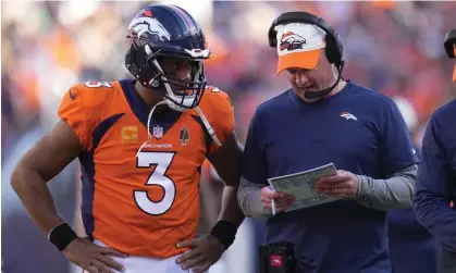  ?? ?? Russell Wilson and Broncos head coach Nathaniel Hackett confer during the team’s win over the Houston Texans. Photograph: Jack Dempsey/AP