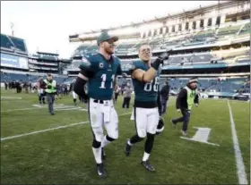  ?? CHRIS SZAGOLA — THE ASSOCIATED PRESS ?? Philadelph­ia Eagles’ Carson Wentz, left, and Zach Ertz walk off the field after an NFL football game against the Chicago Bears, Sunday. Ertz missed the game due to injury and Wentz was hurt in the second half.