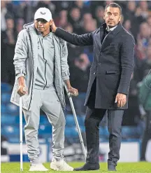  ?? ?? The Rangers fans gave their team loud and colourful backing against Braga, and the injured Alfredo Morelos appeared on the pitch with Giovanni van Bronckhors­t at time up