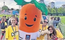  ?? ?? Mascot Kevin the carrot made the walk more ap-peeling