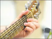  ?? NWA Democrat-Gazette/J.T. WAMPLER ?? An academy student plays guitar Thursday in David Singleton’s guitar class.