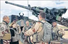  ?? AFP ?? French defence minister Florence Parly (2nd L) talks to French soldiers engaged in the Operation Chammal, which is part of the Operation Inherent Resolve, the internatio­nal coalition against the Islamic State near Al-qaim, a few kilometres away from the last scrap of territory held by IS in east Syria.