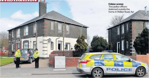  ??  ?? Crime scene
Two police officers stationed outside the home in Walker Road, Ayr