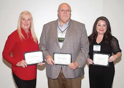  ?? (Contribute­d) ?? El Dorado City Council Member Dianne Hammond, left, Mayor Paul Choate and City Clerk Heather McVay receive certificat­es through the Arkansas Municipal League’s voluntary certificat­ion program. The trio was honored along with other municipal officials and personnel around the state for their completion of the annual program during the 2023 AML Winter Conference. The conference was held in January in Little Rock.