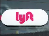  ??  ?? This file photo shows a Lyft logo on a Lyft driver’s car in Pittsburgh. For the
fourth quarter of 2019, Lyft expects its contributi­on margin to decline 1 point to 49%, given
seasonal trends.