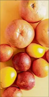  ?? Katie Workman / Associated Press ?? A variety of citrus fruits, including lemons, oranges and blood oranges. The zest and the juice are the two main ways to incorporat­e citrus into your cooking.