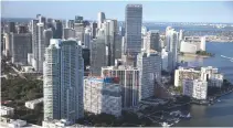  ??  ?? CONDO BUILDINGS are seen on April 5, 2016 in Miami, Florida.