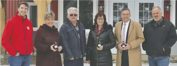  ?? Bill Atwood ?? Federal Agricultur­e Minister Marie-Claude Bibeau (second from left) toured a local sugarbush and held a roundtable discussion Mar. 2 in Elmira. She was joined by Matt Jessop, chair of EMSF; maple syrup producer Terry Hoover; Woolwich Mayor Sandy Shantz; Kitchener-Conestoga MP Tim Louis; and producer Fred Martin.