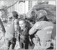  ?? AP/VICTOR R. CAIVANO ?? A protester of Pope Francis’ visit is arrested Tuesday in Santiago, Chile, where the Vatican’s handling of sexual abuse cases has provoked criticism.