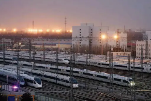  ??  ?? High-speed trains at the depot in Beijing. by Wan Quan