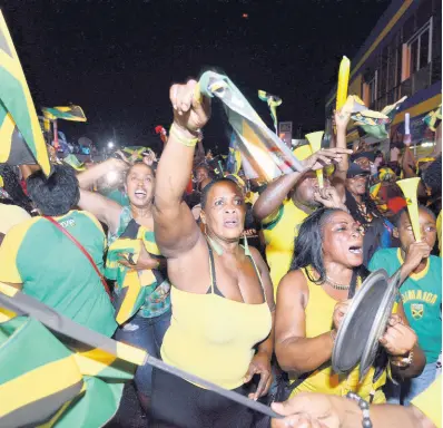  ?? FILE ?? Jamaican fans gather in Half Way Tree, St Andrew, to watch the men’s 100m final at the Olympic Games on Sunday, August 14, 2016.