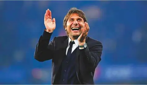  ?? AFP ?? Antonio Conte has signed a new two-year deal with the Premier League champions Chelsea, as the club moved to quell reports of a rift with the Italian. Conte guided Chelsea to the title in his first season last year.