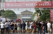  ?? MATT ROURKE — THE ASSOCIATED PRESS FILE ?? People line up to enter the “Made in America” music festival, with the Philadelph­ia Museum of Art visible in the distance on the Benjamin Franklin Parkway in Philadelph­ia.