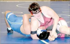  ?? RICK PECK/SPECIAL TO MCDONALD COUNTY PRESS ?? McDonald County’s Lane Pointer nearly has Carthage’s Brener Ocana pinned in their 285-pound match at a dual on Jan. 25 at Carthage High School. Ocana was able to stave off the near pin and came back to pin Pointer in the final minute of the match.