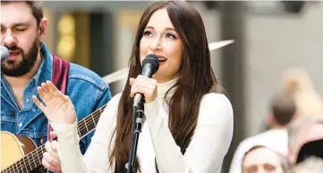  ?? JAMIE MCCARTHY/GETTY ?? Kacey Musgraves, seen performing March 15, has returned to the kind of rootsy, hand-played arrangemen­ts that defined her early work on her album “Deeper Well.”