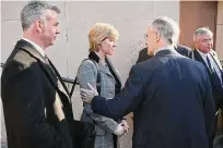  ?? Hearst Connecticu­t Media file photo ?? Assistant State’s Attorney James G. Clark, right, comforts Ellen Jovin, sister of murdered Yale student Suzanne Jovin, following a 2007 news conference about the investigat­ion. At left is investigat­or Patrick Gaffney, and at extreme right is John Mannion, lead investigat­or.