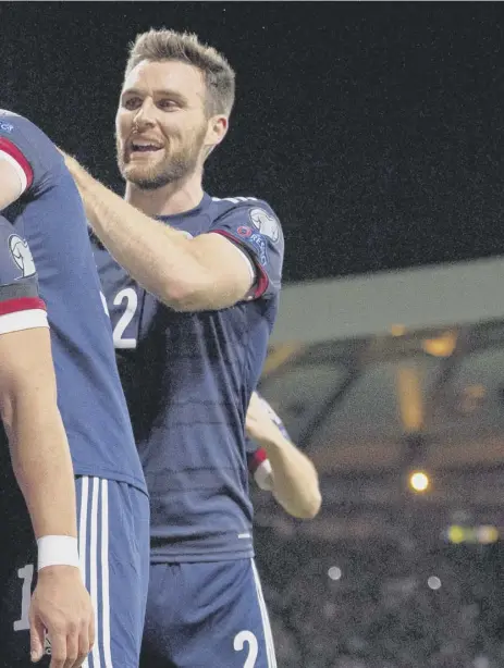  ?? ?? 2 Che Adams made it 2-0 on a memorable night for Scotland