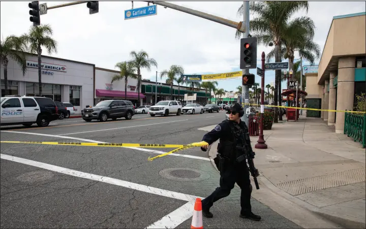  ?? ALISHA JUCEVIC / THE NEW YORK TIMES ?? Police secure the scene of a mass shooting at a dance hall Jan. 22 in Monterey, Calif. In the first 10 weeks of 2023, gunfire in the United States has claimed the lives of more than 8,100 people and left over 6,000 more injured, according to the Gun Violence Archive, a research group that tracks public reports.