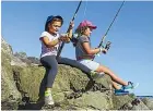  ??  ?? Jakalia, 7, and Shairah Hori, 9, of Bell Block, were hoping for a prizewinni­ng catch.