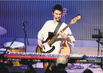  ?? Noah Berger / Special to The Chronicle ?? Jacob Collier has a lot of instrument­s close at hand during his concert at the SFJazz Center.