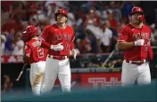  ?? RINGO H.W. CHIU — THE ASSOCIATED PRESS, FILE ?? The Angels' Shohei Ohtani (17) and Mike Trout run back to the dugout after scoring against the Tigers during the third inning of a 2022 game in Anaheim.