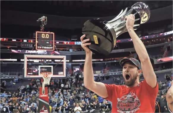  ?? GEOFF BURKE/USA TODAY SPORTS ?? Forward Will Magarity celebrates after Davidson upset Rhode Island 58-57 to win the Atlantic 10 conference tournament at Capital One Arena in Washington, D.C.