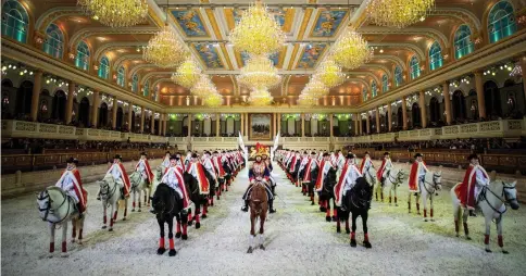  ??  ?? Chinese riders and their horses take part in a performanc­e in the show hall of an equestrian-themed town in Jiangyin, Jiangsu province, some 200 kilometres northwest of Shanghai. Once a week, pristine horses are paraded and perform crowd-pleasing tricks in an opulent arena designed in what the official website calls ‘Austro-Hungarian Empire style’. Rising numbers of Chinese are taking up sports such as horse riding as the country’s growing economy – now the second biggest after the US – gives people more disposable income to pursue leisure activities. — AFP photos