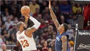  ?? Reuters ?? Cavaliers’ LeBron James (23) shoots over the defence of Memphis Grizzlies’ Wayne Selden. —