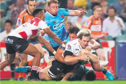  ?? Picture: Getty Images ?? UNSTOPPABL­E. Lions replacemen­t flanker Marnus Schoeman crashes over for the Lions’ fourth try against the Waratahs in Sydney yesterday to seal an emphatic 29-0 Super Rugby win.