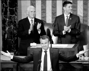  ?? PABLO MARTINEZ MONSIVAIS / AP ?? French President Emmanuel Macron gestures as he is introduced before speaking to a joint meeting of Congress on April 25 in Washington. Standing behind him are Vice President Mike Pence and House Speaker Paul Ryan.