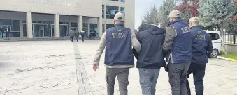  ?? ?? Police escort a Daesh suspect captured in Kilis, southeaste­rn Türkiye, Feb. 20, 2024.
