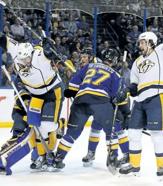  ?? DILIP VISHWANAT/GETTY IMAGES ?? Nashville Predators’ forwards James Neal and Filip Forsberg celebrate after Forsberg scored a goal against the St. Louis Blues in Game 1 of the Western Conference Second Round during the 2017 NHL Stanley Cup Playoffs at the Scottrade Center on...