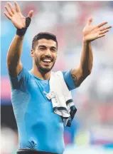  ??  ?? WE MADE IT: Luis Suarez celebrates his team Uruguay’s World Cup win yesterday.