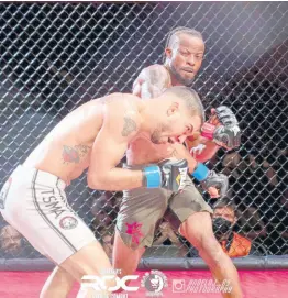  ?? ?? Jamaica’s mixed martial artist Damion Nelson lands a blow to the head of his opponent.